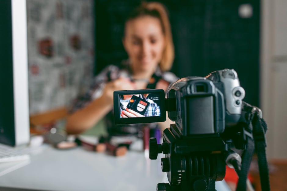 woman in front of camera- JConnelly blog- Encourage more social shares with video storytelling.jpg