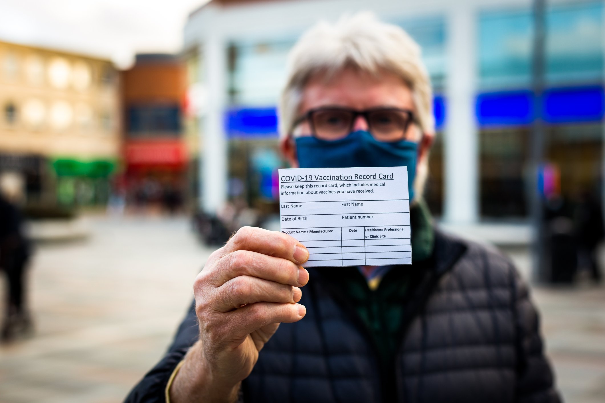 Man Holding Vaccination Card- JConnelly blog- Cause Marketing during Covid