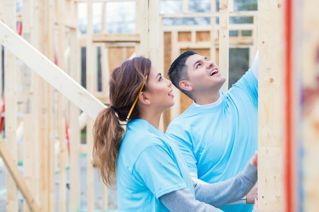 Two people building a home for charity. Philanthropy Is a Part of Who You Are, Not a Quick Way to Build Brand.jpg