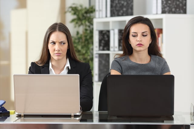 Two women sitting at laptops. There are ways to respond to an insult with dignity and force..jpg