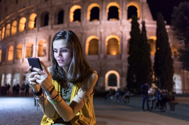 Woman on phone outside. Four Reasons Why Ephemeral Content is a Smart Brand Strategy.jpg